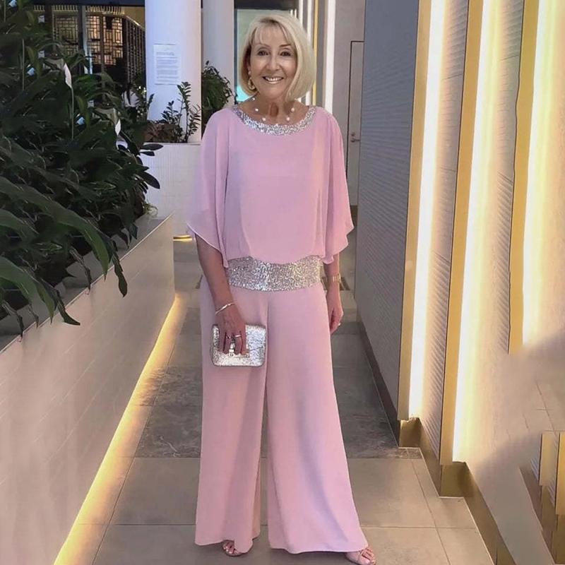 

Комплект жіночий з 2 предметів: футболка з круглим вирізом, кольоровими блоками та паєтками, з рукавами-кажанами; широкі штани. Повсякденна футболка, вільні штани, елегантний костюм для ділових зустрічей, мода весна/літо 3XL рожевий