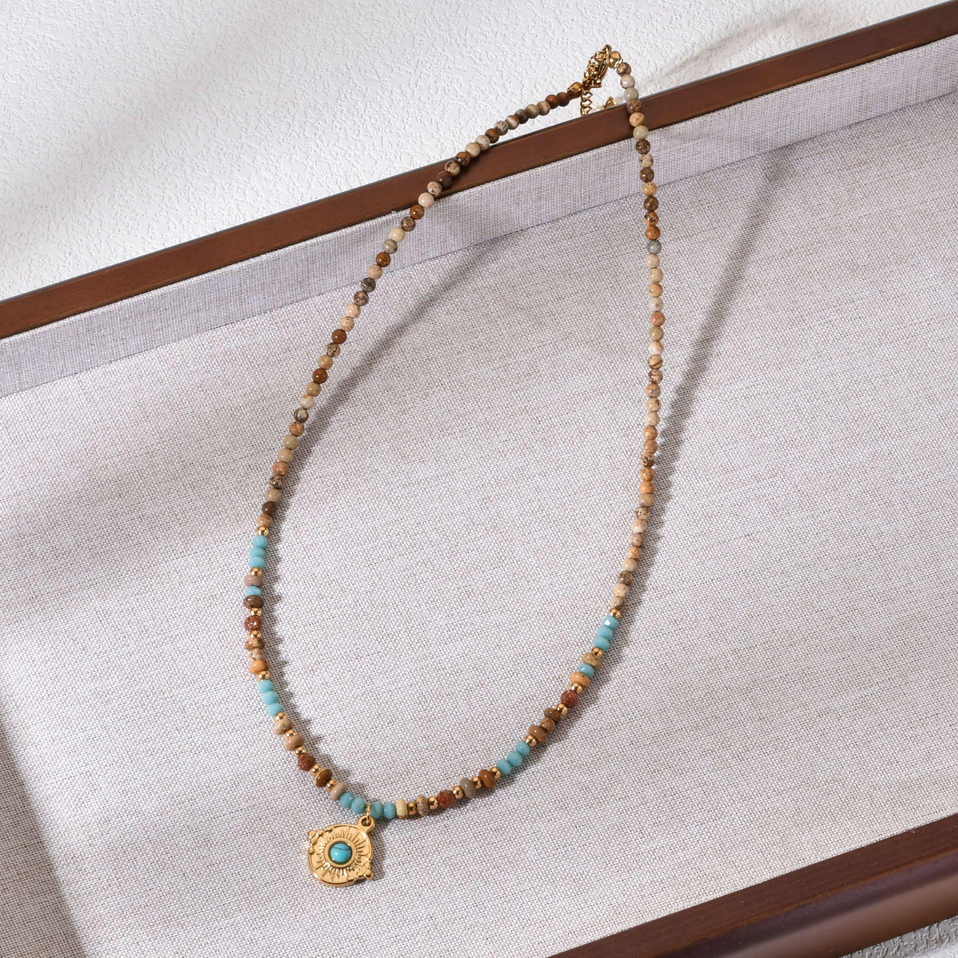 Bohemian Style African Pine Bead Necklace with Stainless Steel Pendant.