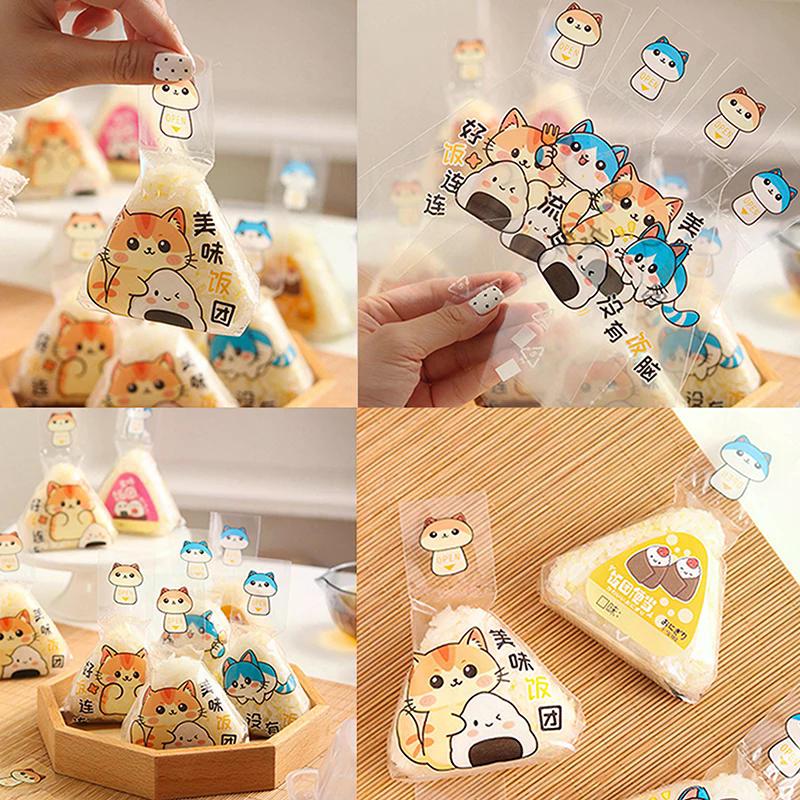 100 ks Krásný kreslený trojúhelník Balicí sáček s rýžovými kuličkami Mořské řasy Onigiri Sushi Nástroje na výrobu forem Bento Příslušenství
