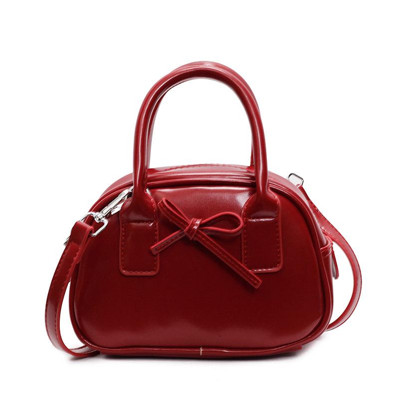 Hot Sale Premium Textured Oil Wax Leather Hand Carry Bowling Bag Niche Fashion Bow Versatile Messenger Women's Bag