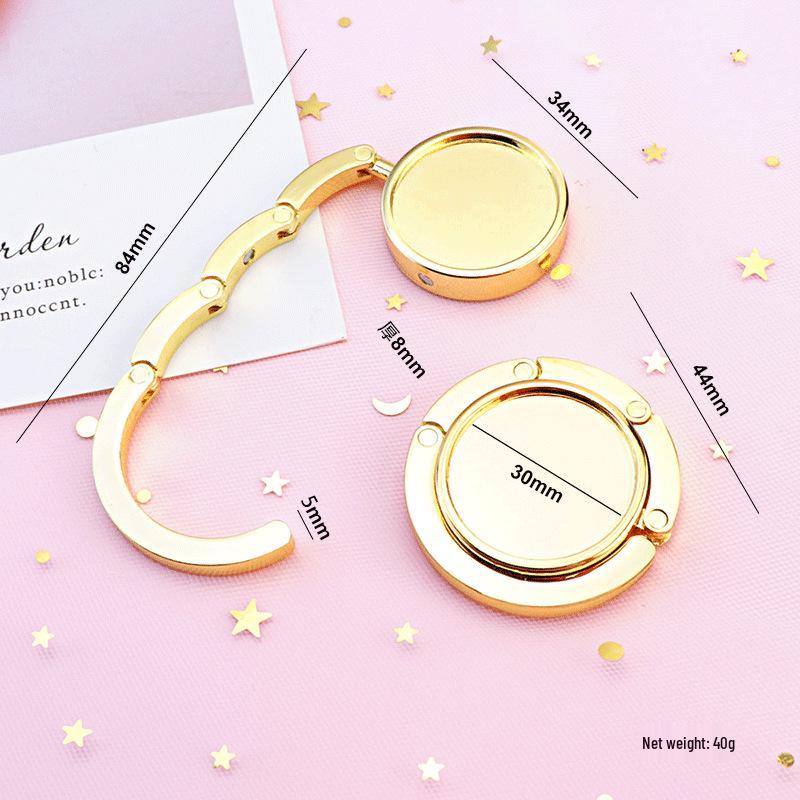 Kreativer Tragbarer Faltbarer Handtaschenhaken - Runder Metallaufhänger und Praktisches Souvenir