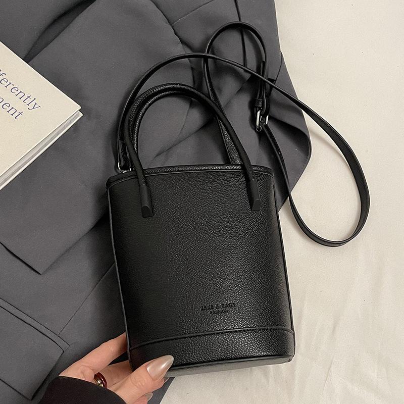 Wholesale New Products Niche Simple Solid Color Lychee Pattern Texture Hand Carry Bucket Bag Versatile Foreign Style Commuting Messenger Women's Bag