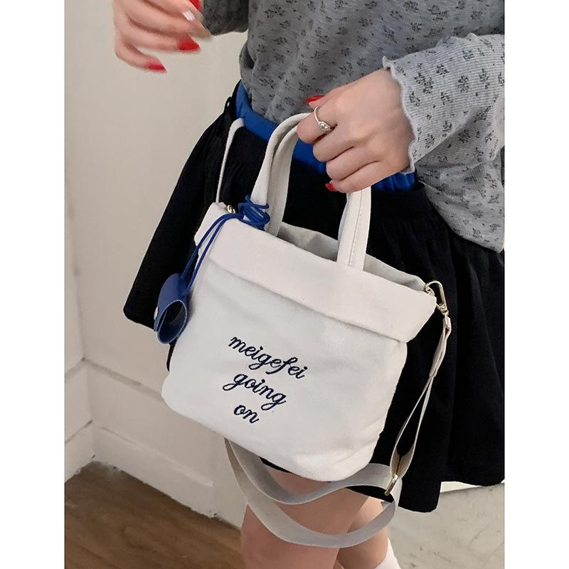 

Korean lazy style literary portable canvas bag women 2025 new casual versatile embroidered letter bucket bag бежевый