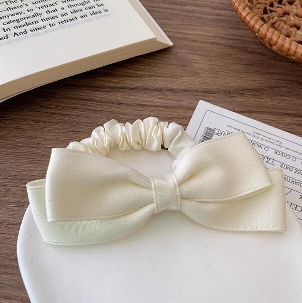 

Черная резинка для волос с бантом для женщин - Элегантный аксессуар для хвостика 2025