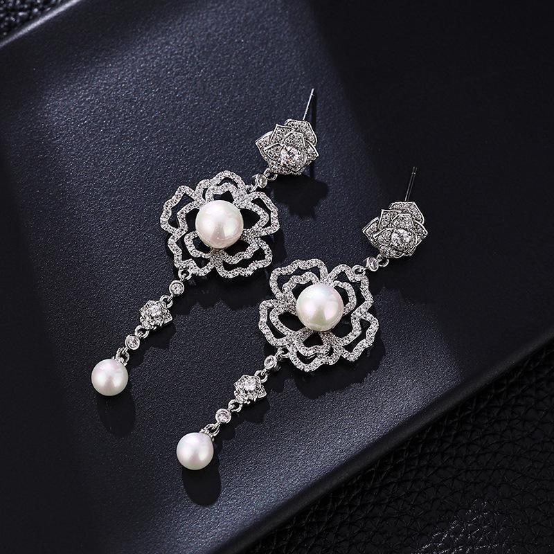 

Pearl Dangle Earrings for Women - Elegant, Versatile, Unique Design серебряный