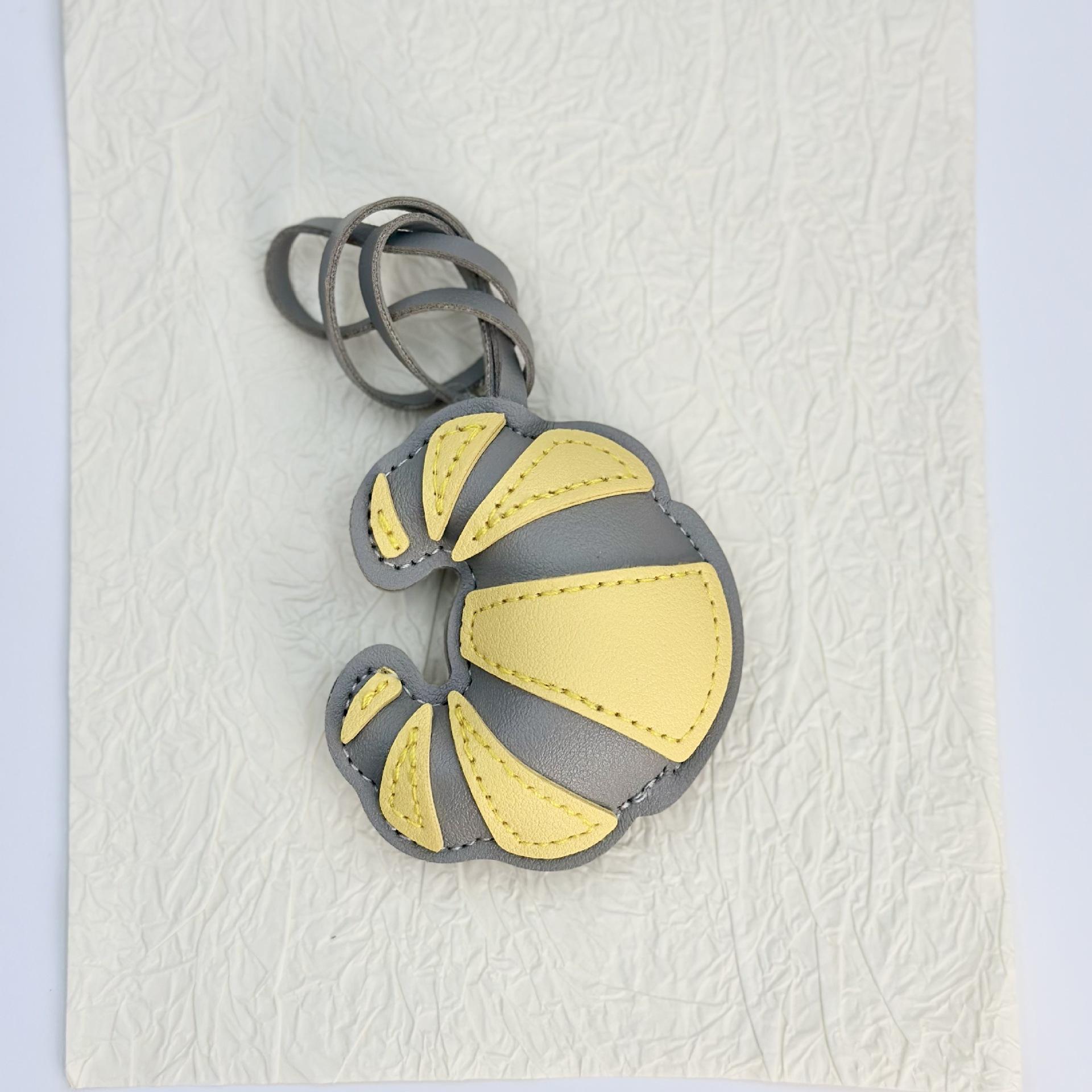 Cross-border simulated leather leather handmade croissant bag buckle pendant pendant handmade bag pendant factory wholesale