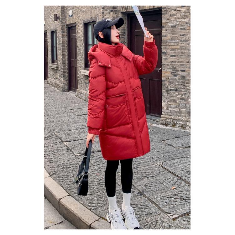 Μείνετε ζεστή και κομψή τον χειμώνα με αυτό το γυναικείο παλτό με κουκούλα μεσαίου μήκους σε κορεατικό στυλ.