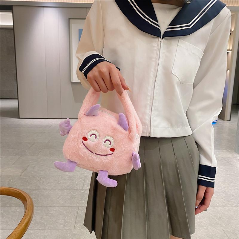 Autumn and Winter Fashion Plush Cartoon Portable Little Monster Three-eyed Flip Bag Large Capacity Double-sided Women's Bag Storage Bag