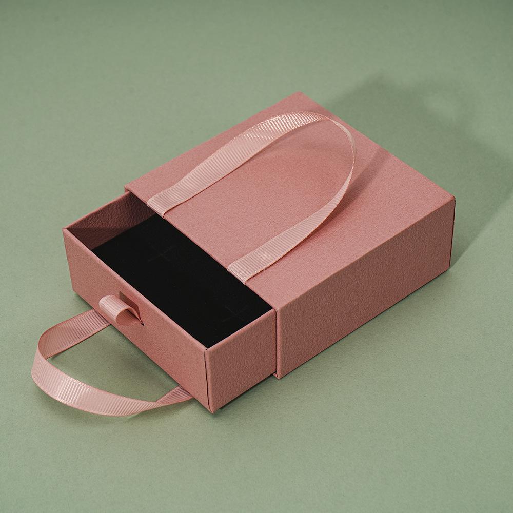 Compact Portable Jewelry Box for Rings, Necklaces, and Ear Studs - Simple Design, Ready for Gift-Giving.