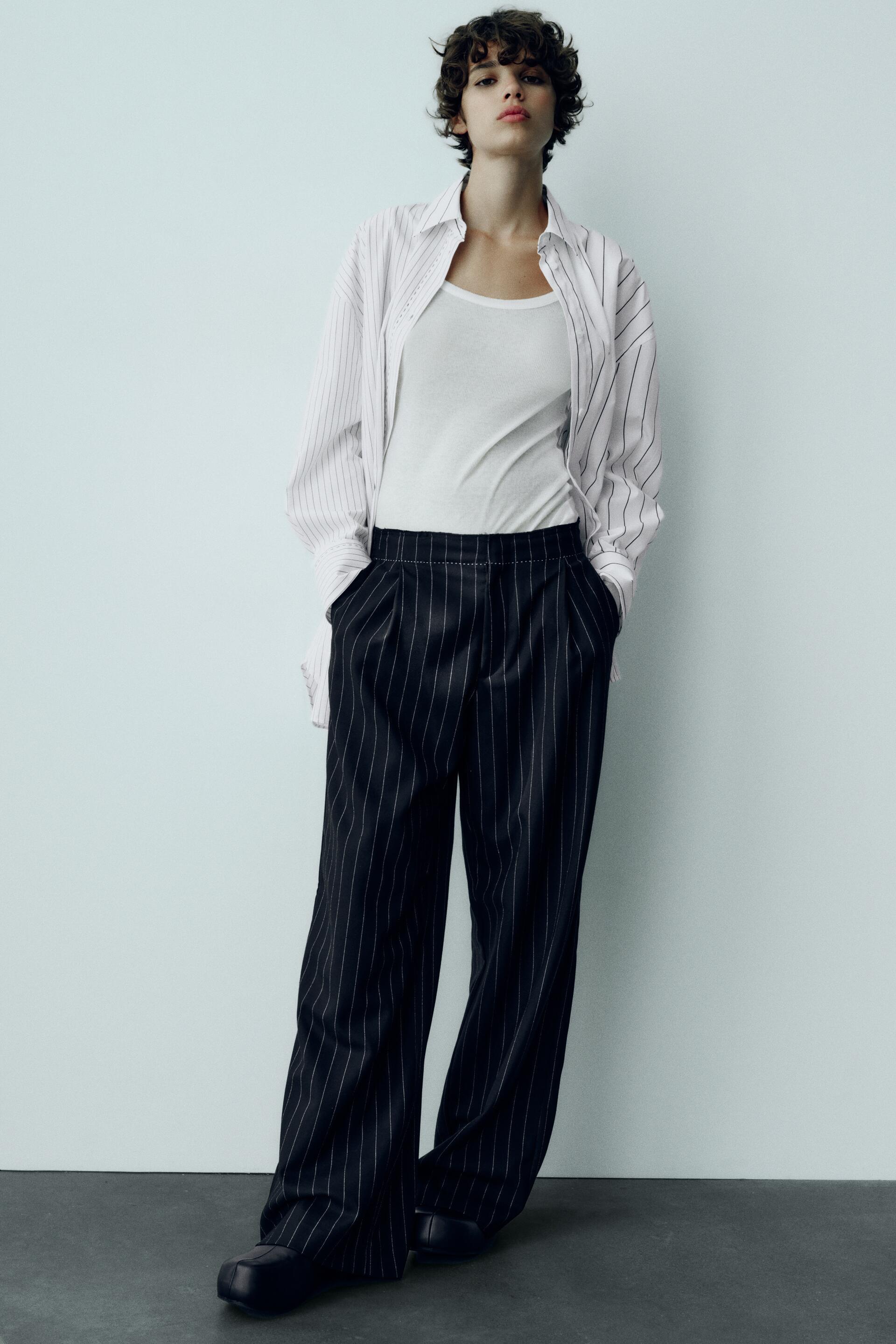 

БРЮКИ В ПОЛОСКУ С ОТСТРОЧКОЙ