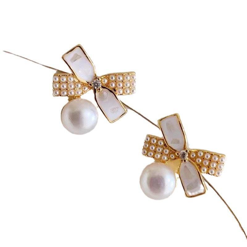 Korean sweet natural freshwater pearl stud earrings ins temperament 911 silver needle bow earrings women's high sense