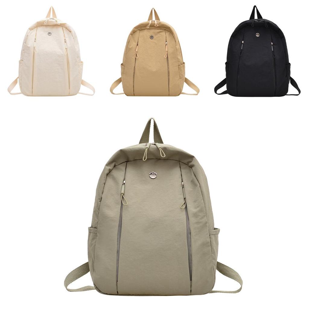 Lightweight Nylon Backpack For Commuting And Travel Withsmall Golden Roundel Decoration