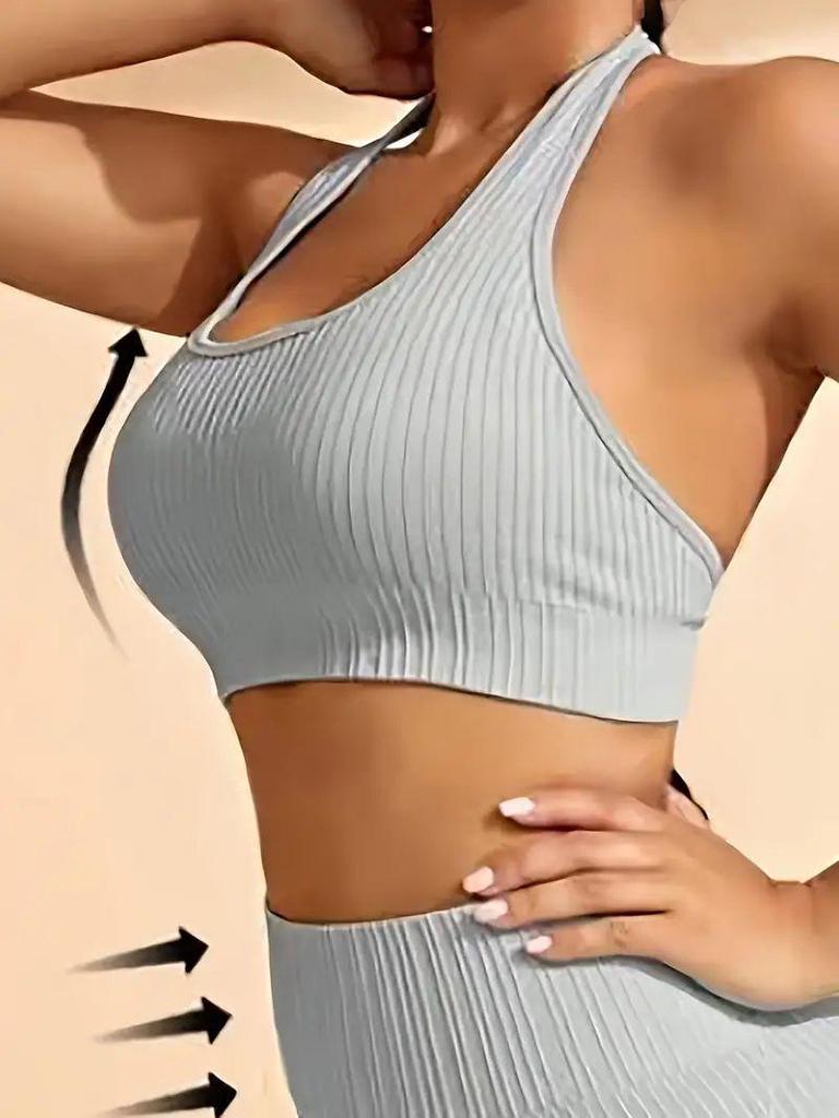 Seamless Knitted Halter Neck Two-Piece Sports Set for Women - Includes Back Detail Short Sleeve Top and Bra with Chest Pads, Plus Shorts.
