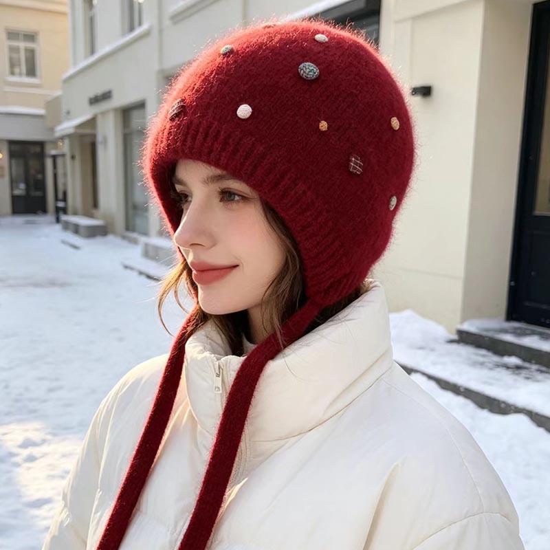 Autumn and winter Angola rabbit fur ear protection knitted hat women's color button decorative lace-up wool hat outdoor cold hat tide