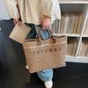 Casual straw woven tote bag for women, 2026 new letter handbag, simple large capacity vacation beach woven bag