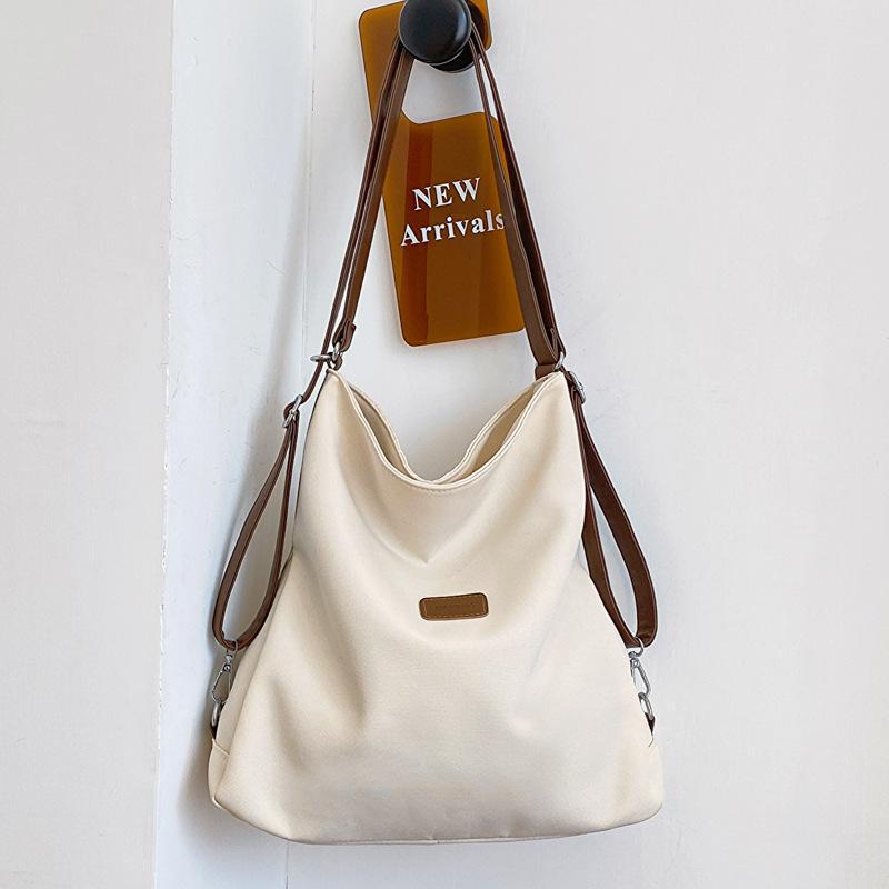 

Three-purpose backpack spring and summer new backpack school bag female college student canvas bag female shoulder messenger bag No specification