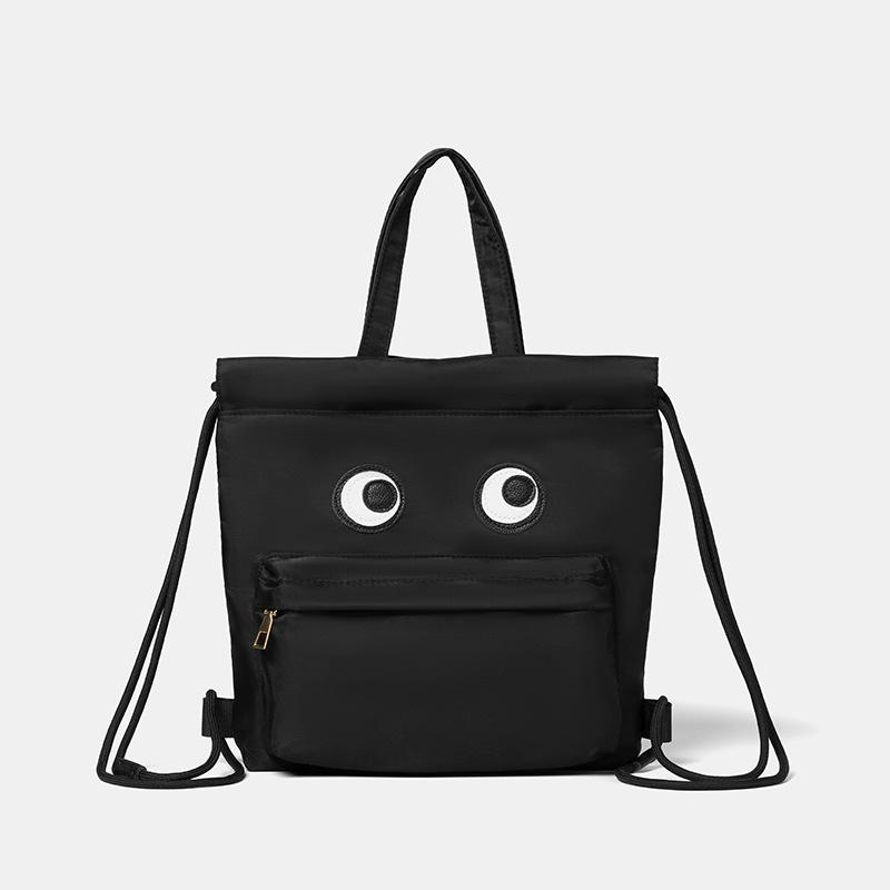 

Large capacity nylon waterproof bag Women s tide casual drawstring bucket bag Versatile backpack Cute big eye backpack
