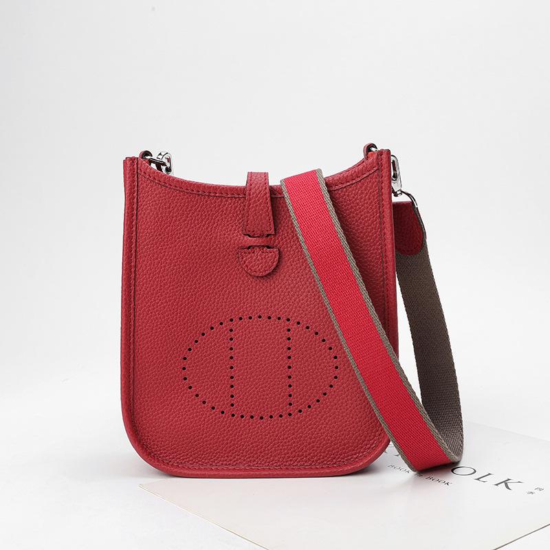 Factory wholesale first layer togo cowhide bucket bag women's bag lychee pattern hollow single shoulder crossbody bag hollow design