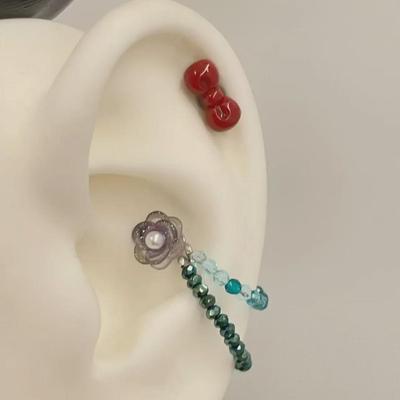 Retro Rosenbogen-Ohrringe mit Original-Cochlea-Design und Kettenintegrierten Ohrknochen-Steckern