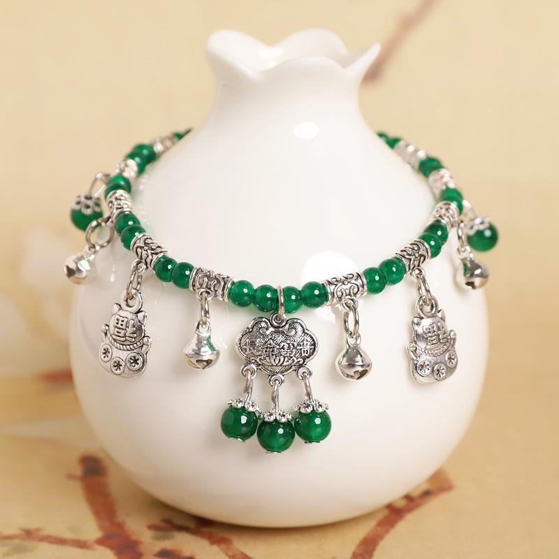 

Зеленые глазурованные колокольчики, звенящие плетеные браслеты на ногу, ретро замки долголетия, бахрома, новые китайские этнические женские аксессуары