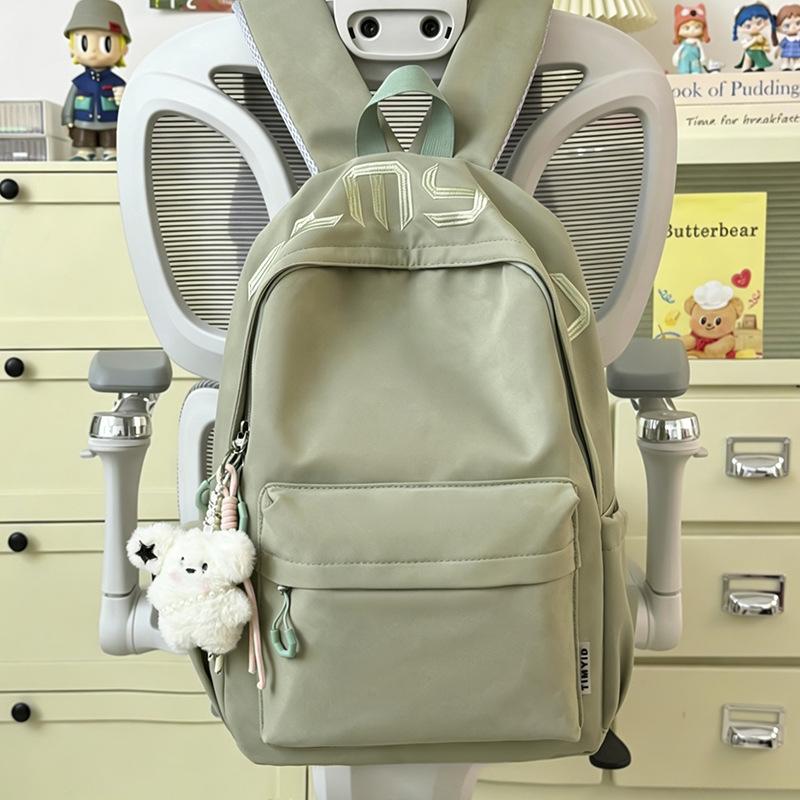 Schoolbag Japanese simple and versatile large-capacity solid color campus schoolbag 1011 summer new light commuter student backpack