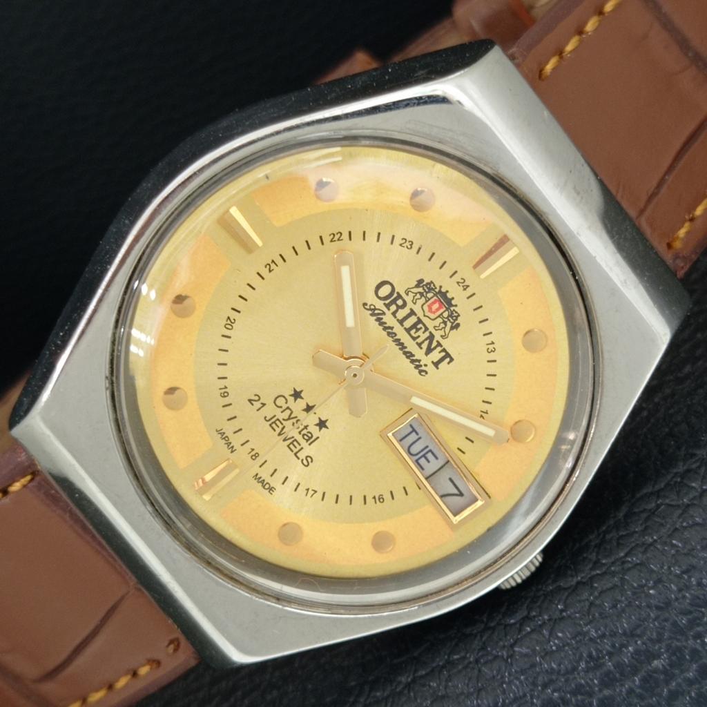 

JAPAN VINTAGE ORIENT CRYSTAL 46941 AUTOMATIC MENS GOLDEN DIAL WATCH a706888-1