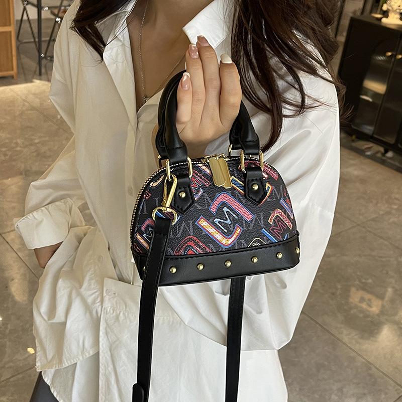 

Mini shell bag 2025 new Korean version of fashion rivet printing shoulder bag women s versatile messenger small square bag tide