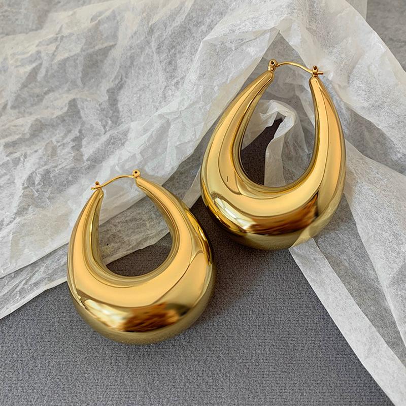 

Metal smooth oval water drop ear buckle European and American simple fashion earrings light luxury high sense earrings design sense niche