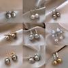 Silver needle zircon butterfly pearl earrings niche design light luxury stud earrings French high-end retro earrings wholesale