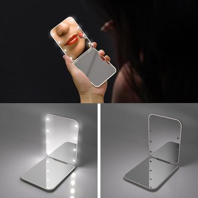 Miroir de maquillage pliable blanc avec éclairage LED, idéal pour les voyages et comme cadeau (1 pièce).
