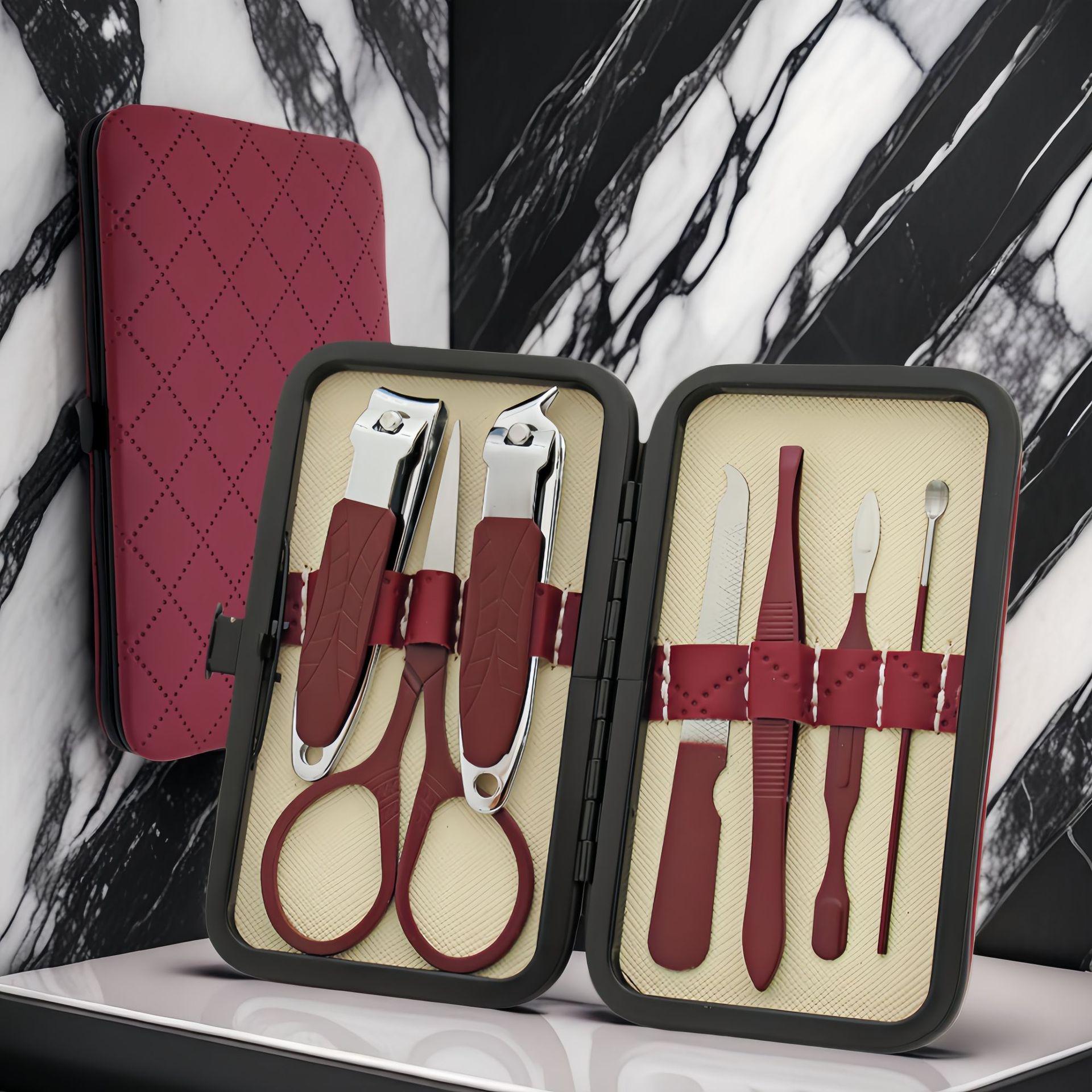 28-Piece Stainless Steel Nail Clipper Beauty Tool Set – Includes Pedicure Knife, Eyebrow Trimmer, and Brown Case.