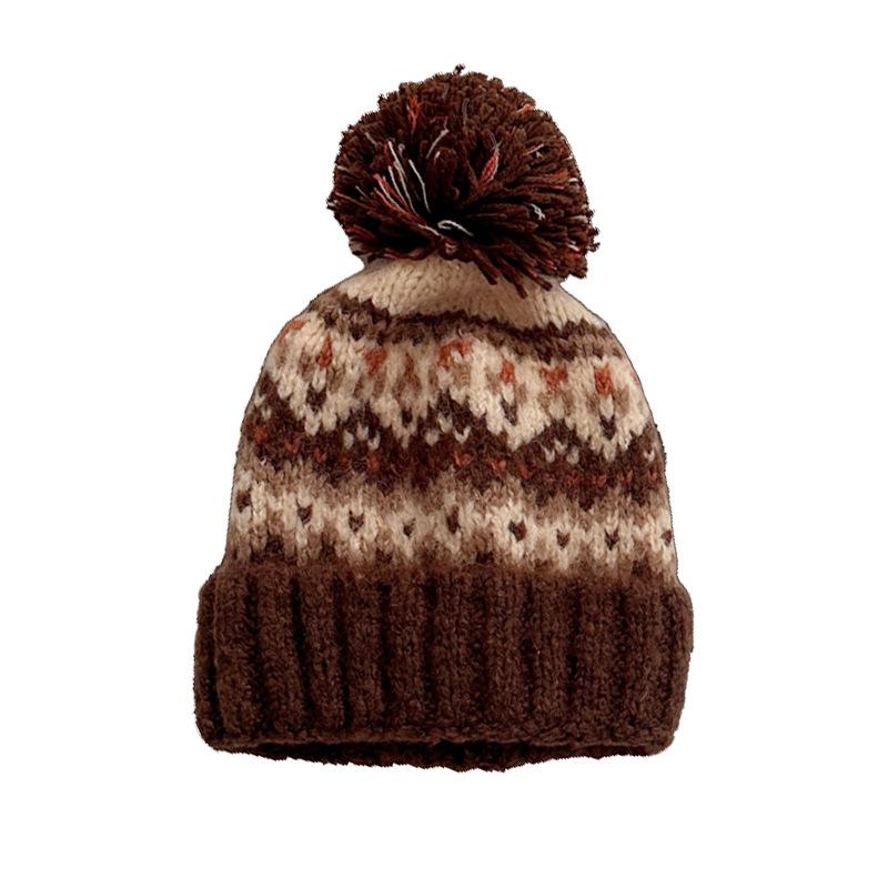 Winter new jacquard contrasting wool hat women's thickened warm windproof hat pullover hat cute hairball knitted hat