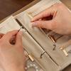 Organisateur de bijoux en forme de livre Sac à bijoux de voyage élégant Rangement en cuir PU Poches zippées en cuir PU Classeur Pour usage domestique Sac à main