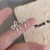 2025 Minimalist Silver Bow Earrings: Elegant, High-End, Unique Design for Women.