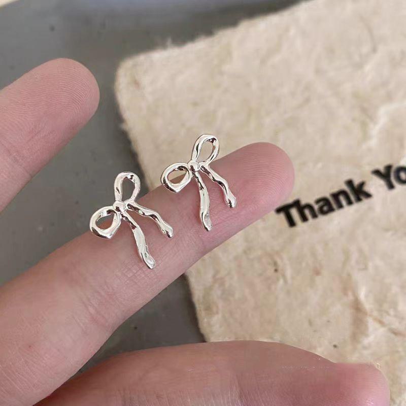 2025 Minimalist Silver Bow Earrings: Elegant, High-End, Unique Design for Women.