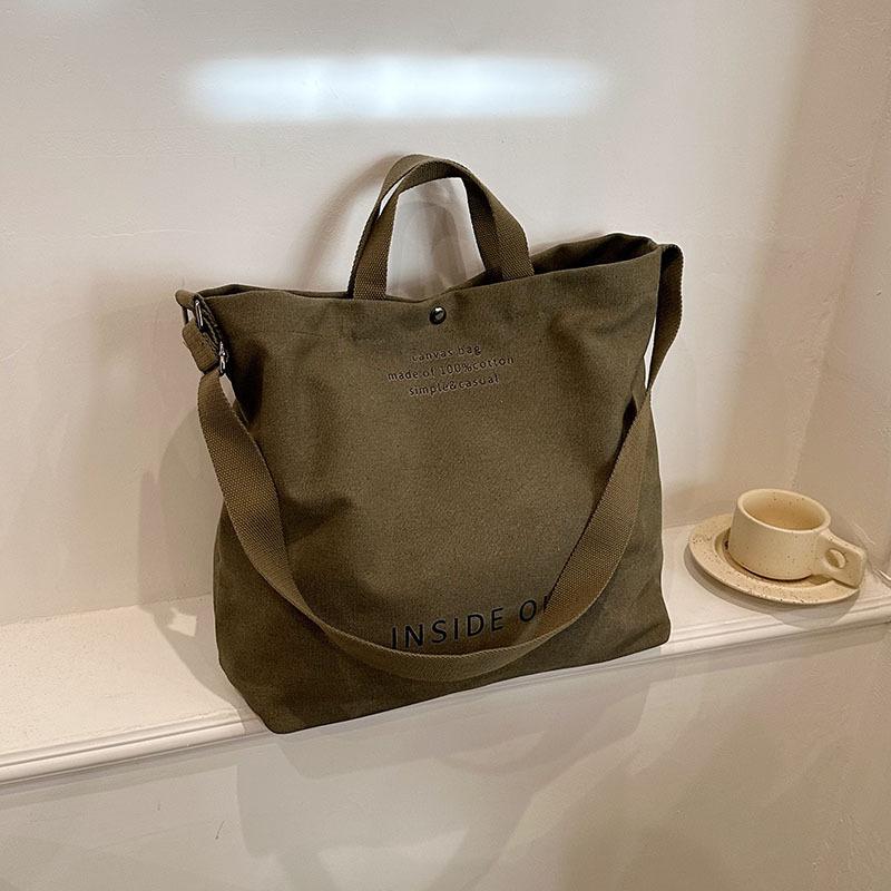Borsa a tracolla semplice in tela da uomo e da donna. Borsa a tracolla in tela spessa. Borsa a tracolla per studenti d'arte di grande capacità