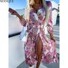 MODIQUE 2025 Summer New Women's Sexy Vintage Hot Floral Printing Waist Flowing Long Dress Ladies Folk Casual Long Sleeve Deep V-Neck Dress