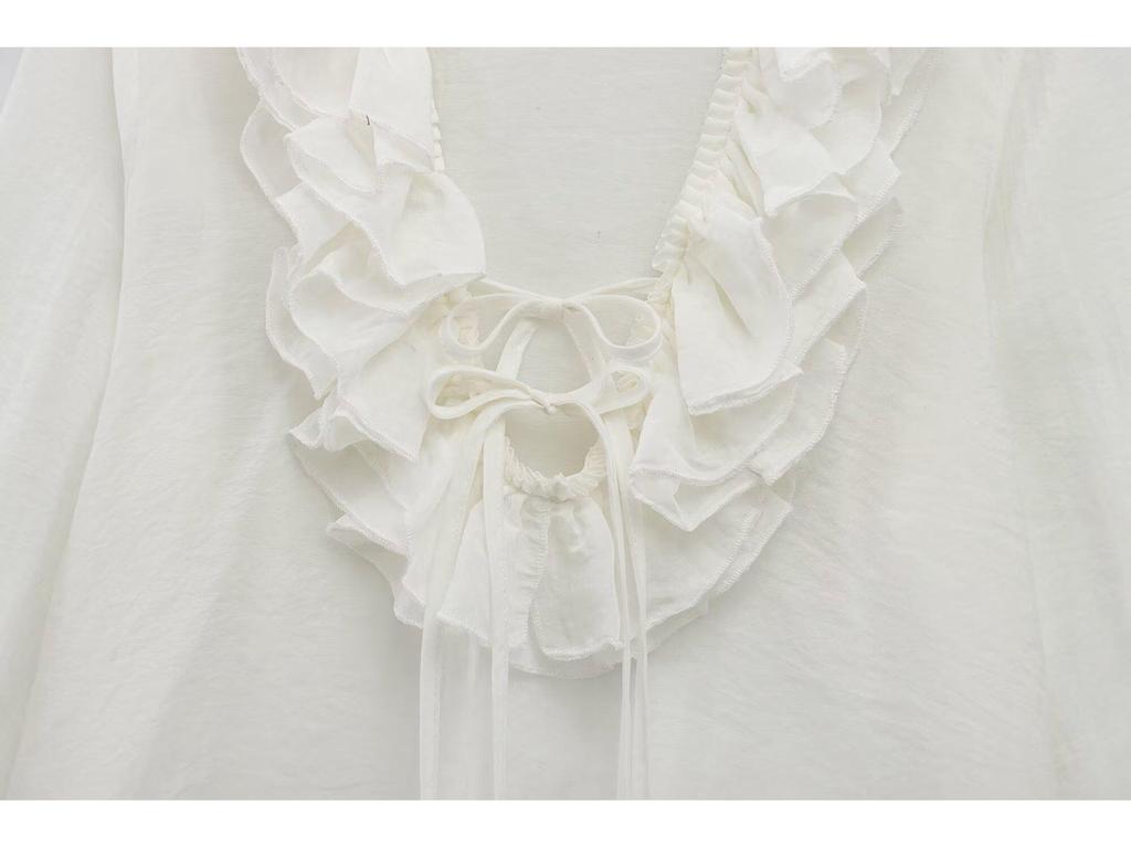 Chemise polyvalente à volants et à nouer style européen et américain pour femmes printemps 2025