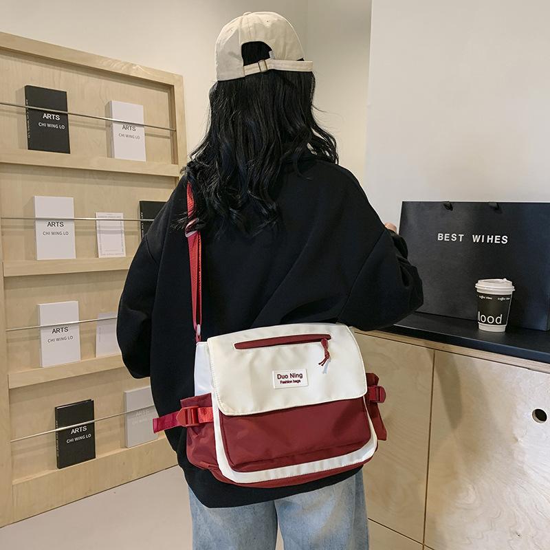 Small fresh and versatile women's new mailman bag color matching high value campus students make-up class crossbody soft girl class backpack