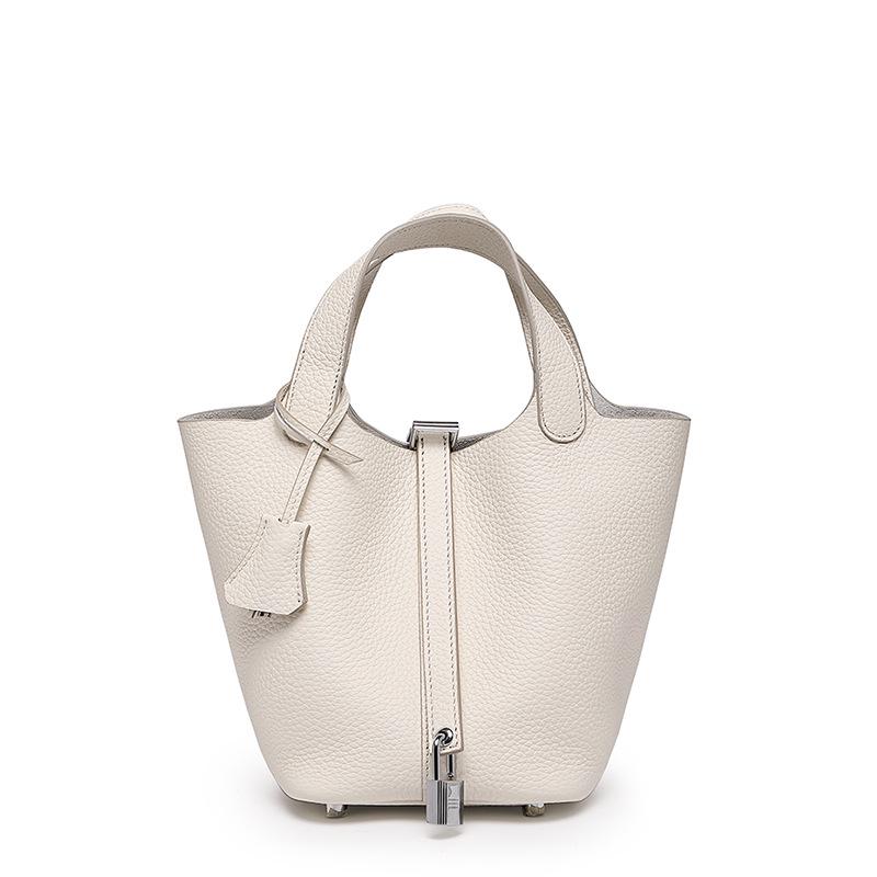 

Жіноча сумка-відро зі шкіри корови: Маленький, універсальний, преміальний для роботи або поїздок