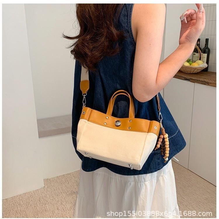 New niche design simple fashion canvas large capacity commuting wind tote bag casual texture hand