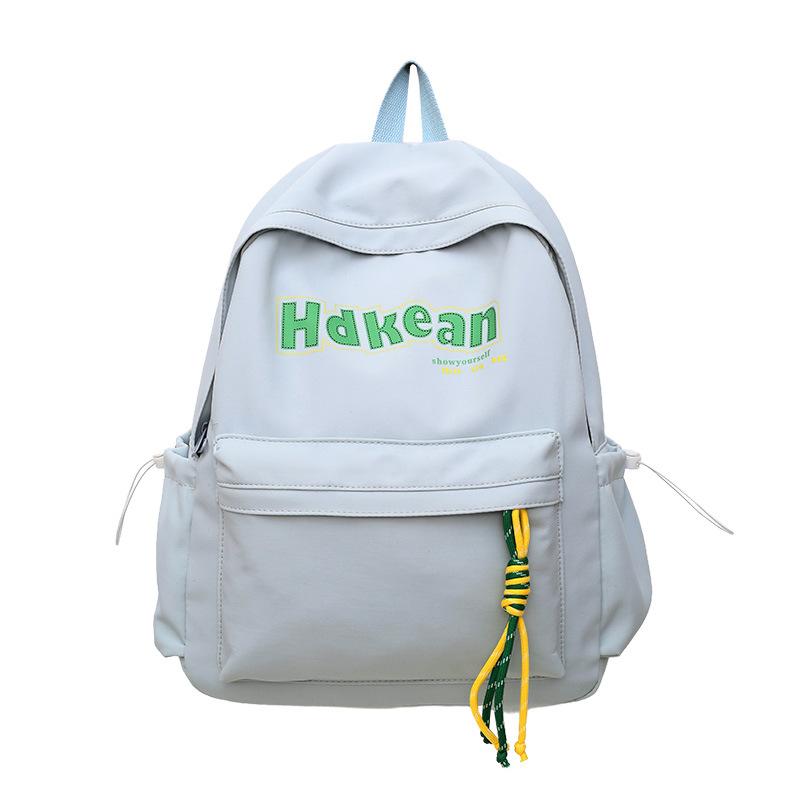 

Summer New High-Value Fresh Solid Color Backpack for Girls and Boys Elementary and Middle School Students Letter Backpack Small(26*15*36cm) синій