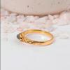 Delicate Gold Marquise Labradorite Ring: Vintage-style ring with ornate filigree band and small navette gemstone.
