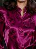An elegant women's all-purpose blouse made of silk with a floral pattern, suitable for suburban trips.