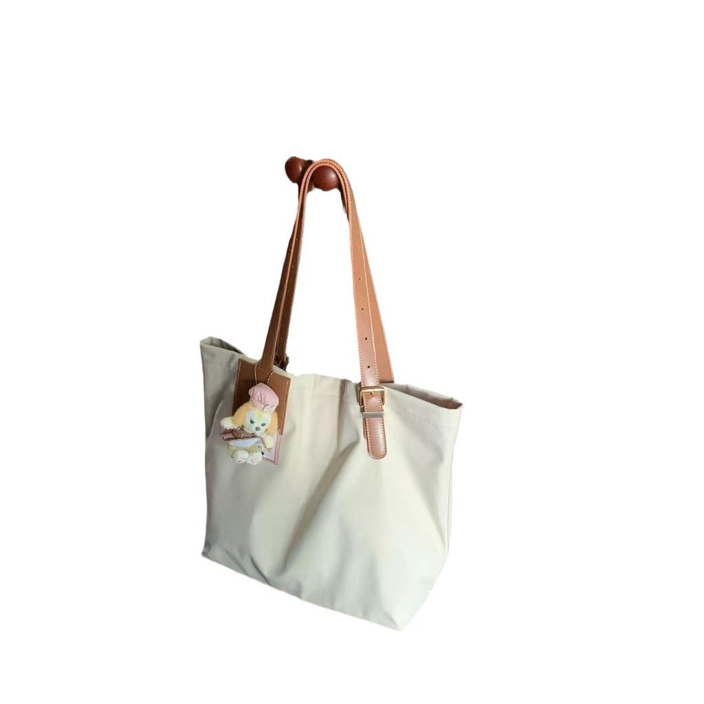 2024 Korean version of large-capacity nylon cloth bag, simple and lightweight tote bag, women's casual commuter underarm shoulder bag.