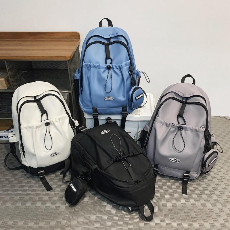 Backpack simple and fashionable college student junior high school student schoolbag female nylon large capacity leisure travel backpack male