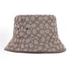 Coach Chapeau seau en toile jacquard signature, motif logo C classique allover, mélange de coton recyclé, à larges bords, kaki, vintage, luxe, protection UV, chapeau de pêcheur
