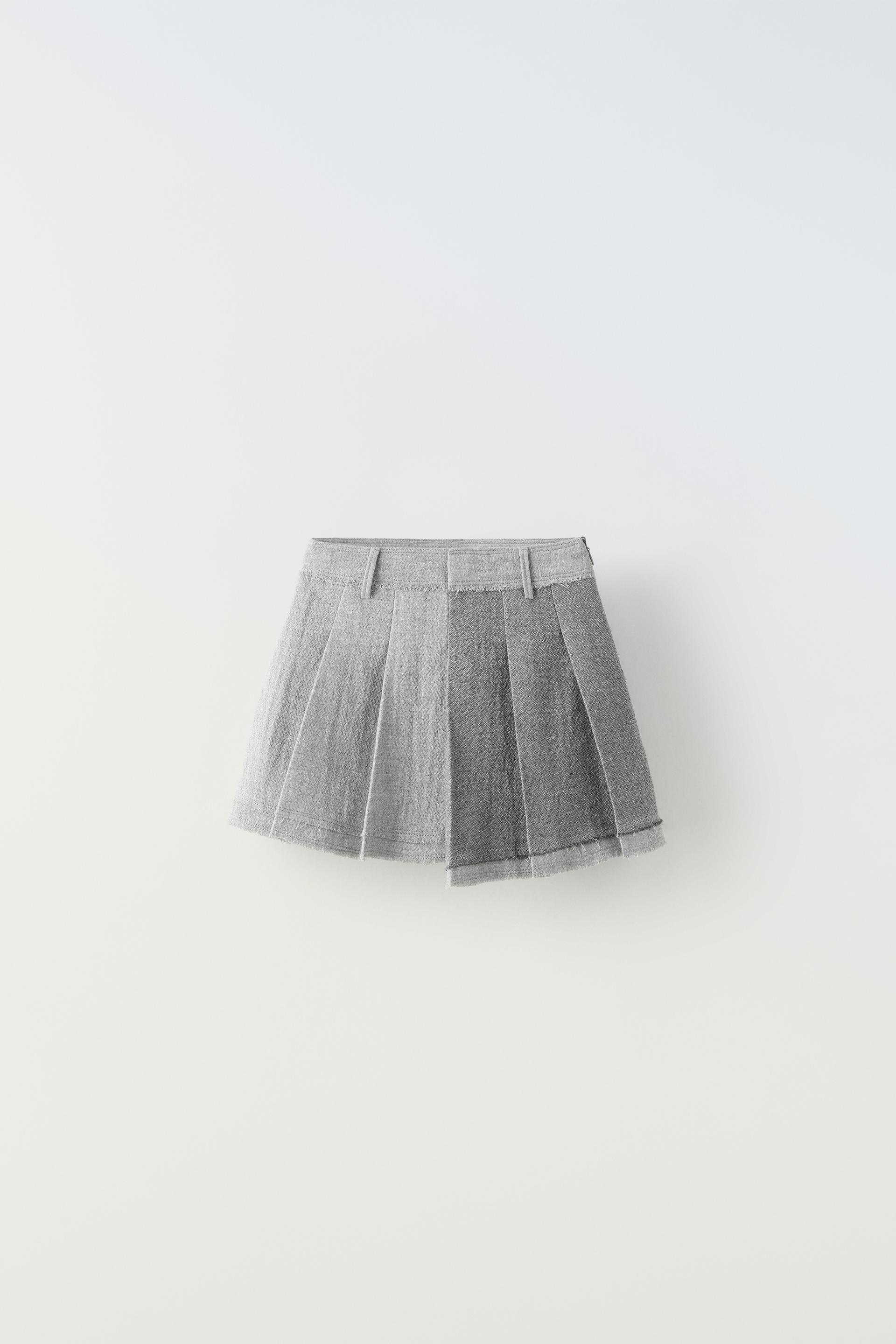 

ASYMMETRIC SKIRT WITH FRAYED HEM