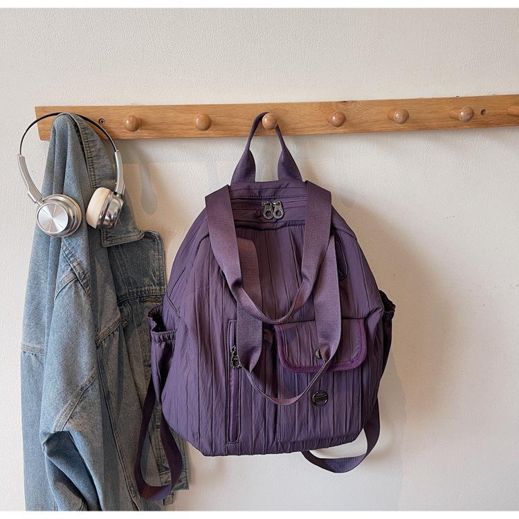 

Simple casual backpack men s and women s lightweight outdoor portable sports bag multi-functional storage commuter shoulder bag фіолетовий