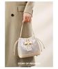 Guangxi Zhuang Brocade Heritage Women's Bow Drawstring Bag - 2026 New Chinese Style Crossbody Bucket Bag